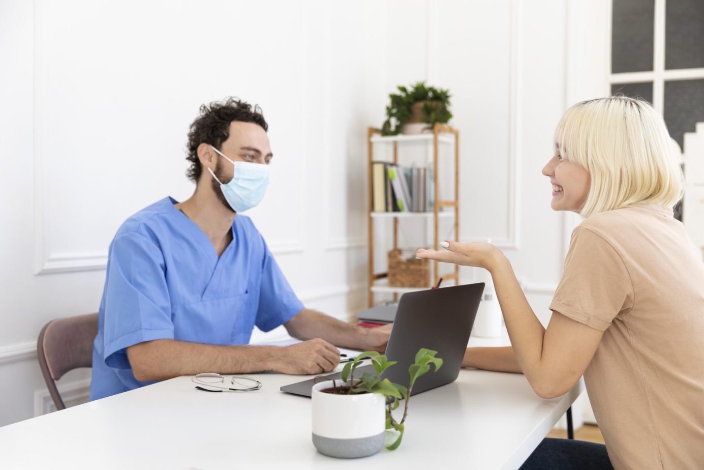 close-up-person-talking-with-doctor-about-vaccination